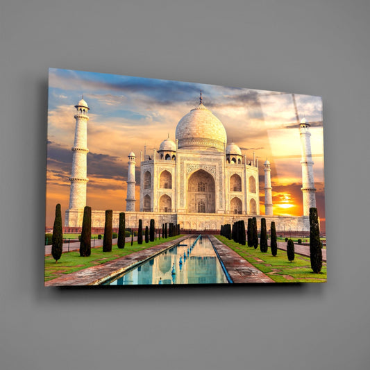 Taj Mahal glass wall art on a plain gray wall, angled to show the glossy surface