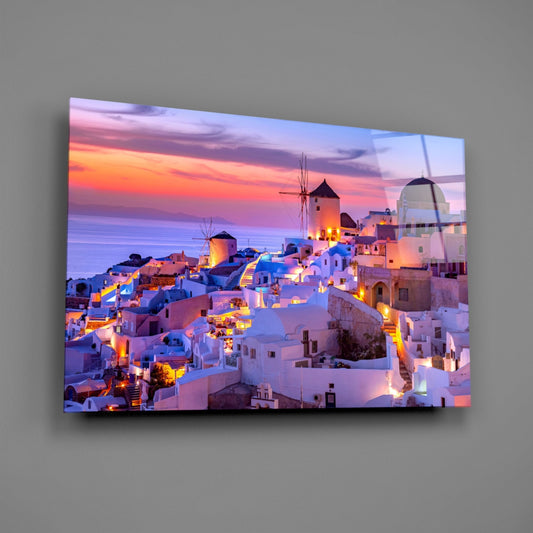 Santorini sunset glass wall art on a gray wall with a soft glossy glare