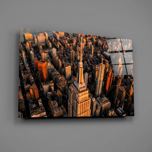New York aerial skyline glass wall art on a gray wall, light catching the glossy front