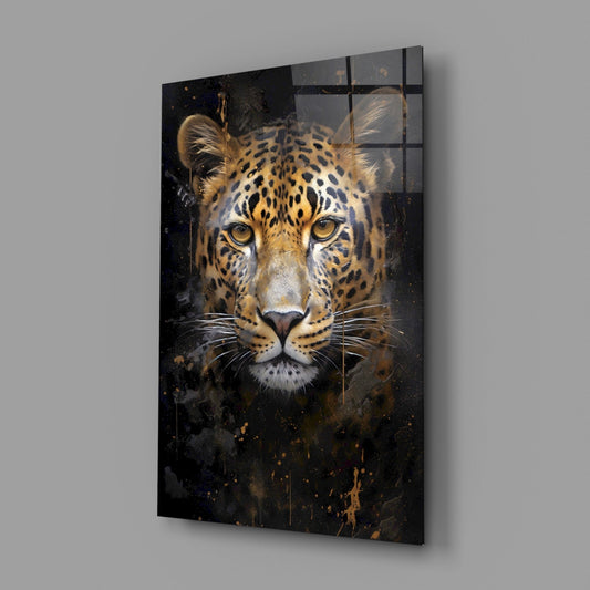 Amber-eyed leopard glass wall art on a gray wall, light reflecting off the glossy front