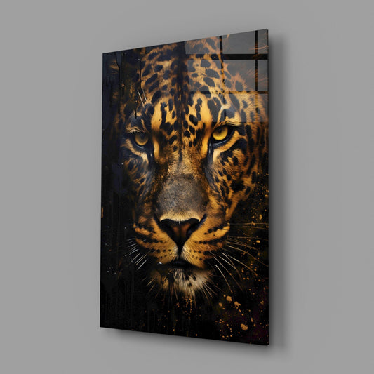 Shadowed leopard face glass wall art on a gray wall, light reflecting off the glossy front
