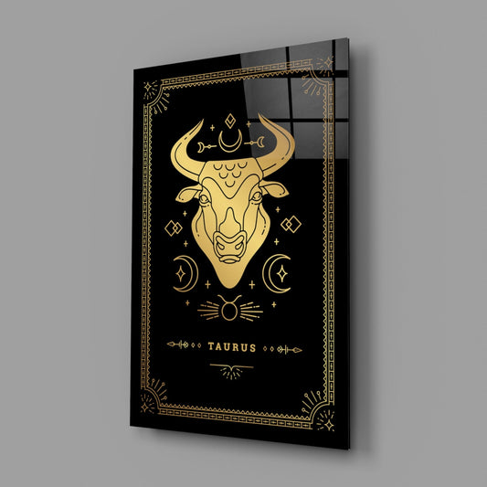 Taurus zodiac glass wall art on a gray wall, light reflecting off the glossy black front