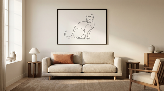 Stylish cat wall art ideas: a framed black-and-white line-art cat print above a sofa