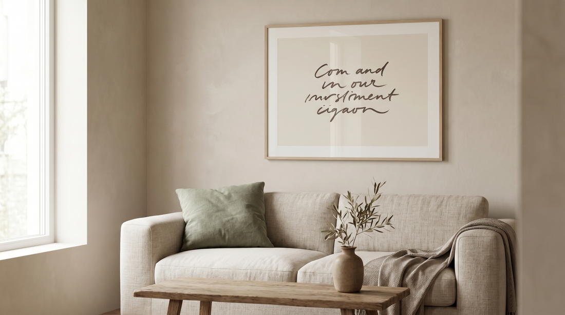 Modern christian wall art ideas: a framed minimalist scripture print in a clean typeface above a neutral sofa in a contemporary living room