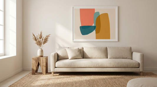 Colorful wall art ideas styled above a sofa with a coral, teal, and ochre abstract print