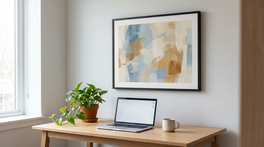 Inspirational office wall art ideas: a framed abstract print above a wood desk in a bright modern office