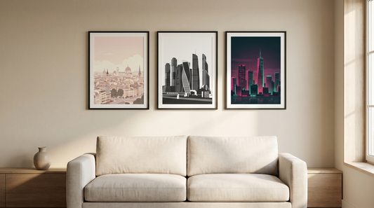City poster decor ideas: three framed stylized skyline prints grouped above a sofa