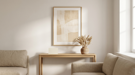 Certificate of authenticity art meaning, a framed print on a wall beside a small plain certificate card on a console table