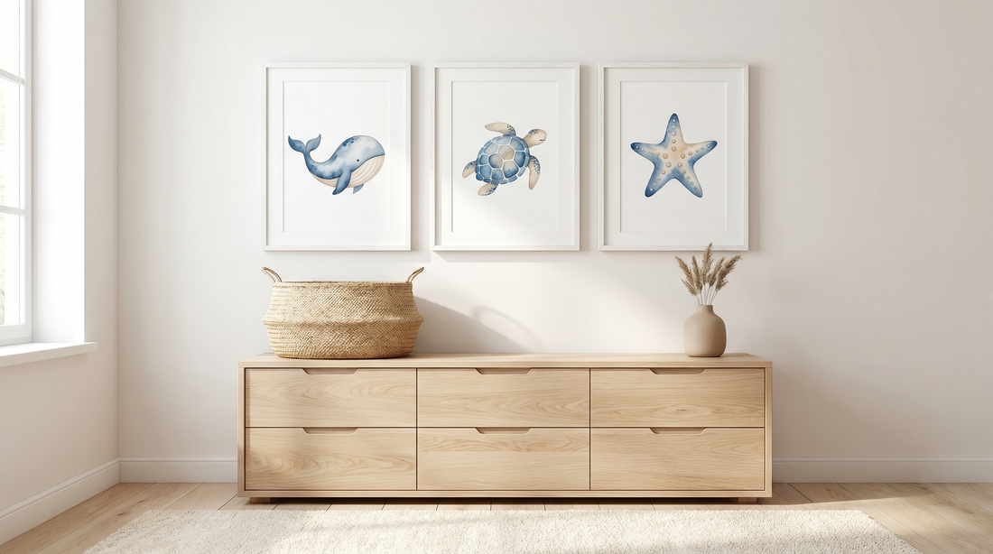 Ocean animal poster ideas: framed whale, octopus, and sea turtle prints over a white nursery dresser