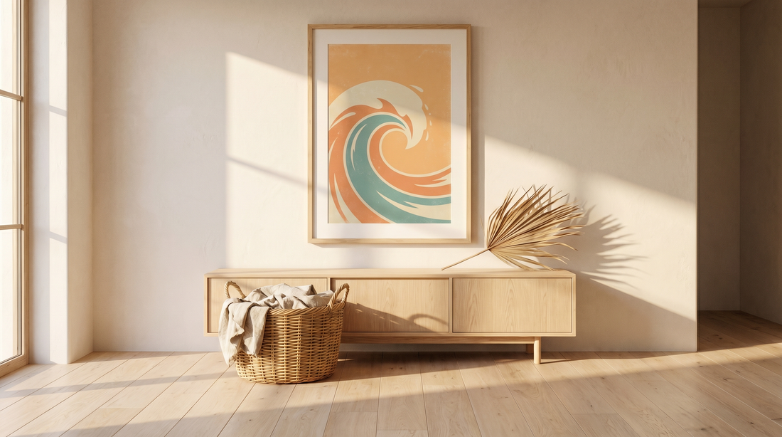 Surf decor ideas home: a framed vintage-style surf travel print above a low oak console in a sunlit room