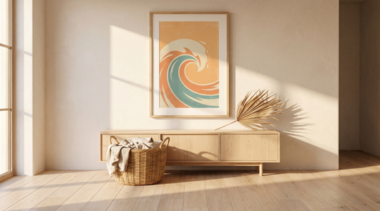 Surf decor ideas home: a framed vintage-style surf travel print above a low oak console in a sunlit room