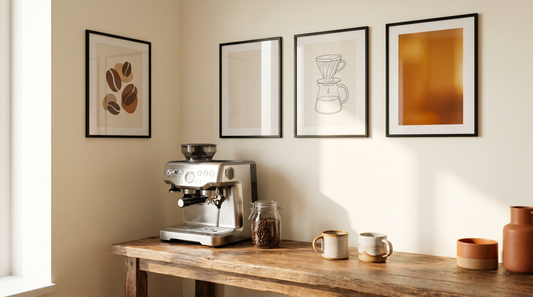 Coffee decor ideas for the kitchen with three framed coffee wall art prints above a small espresso station