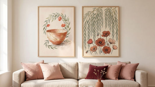 Two framed botanical prints above a linen sofa in a blush and terracotta room that reads romantic year-round