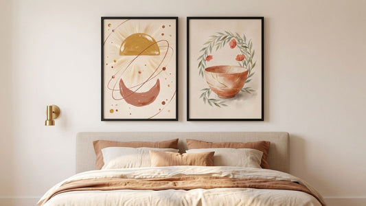A balanced pair of framed prints above a bed, sized and hung to avoid the most common above-bed mistakes