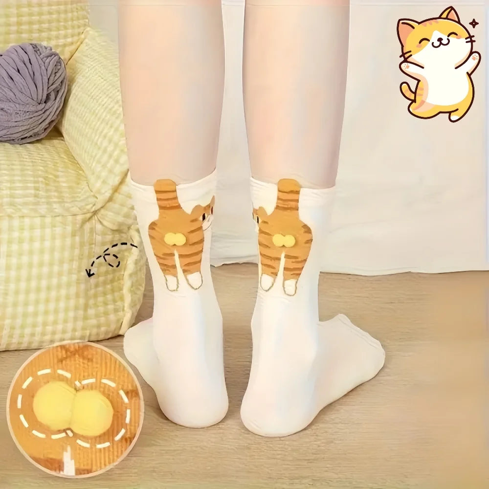 White socks with cat design worn by a person, sitting on a couch with a ball of yarn.