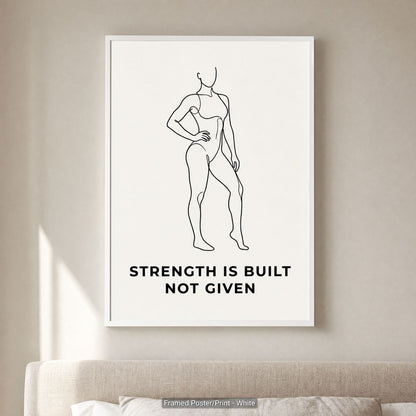 White frame option on a pale wall above a cushioned sofa, minimalist wall art in a calm neutral room