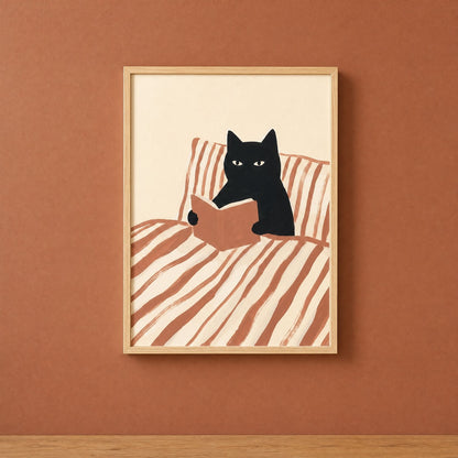 Black cat reading book print framed in natural wood on a deep terracotta wall