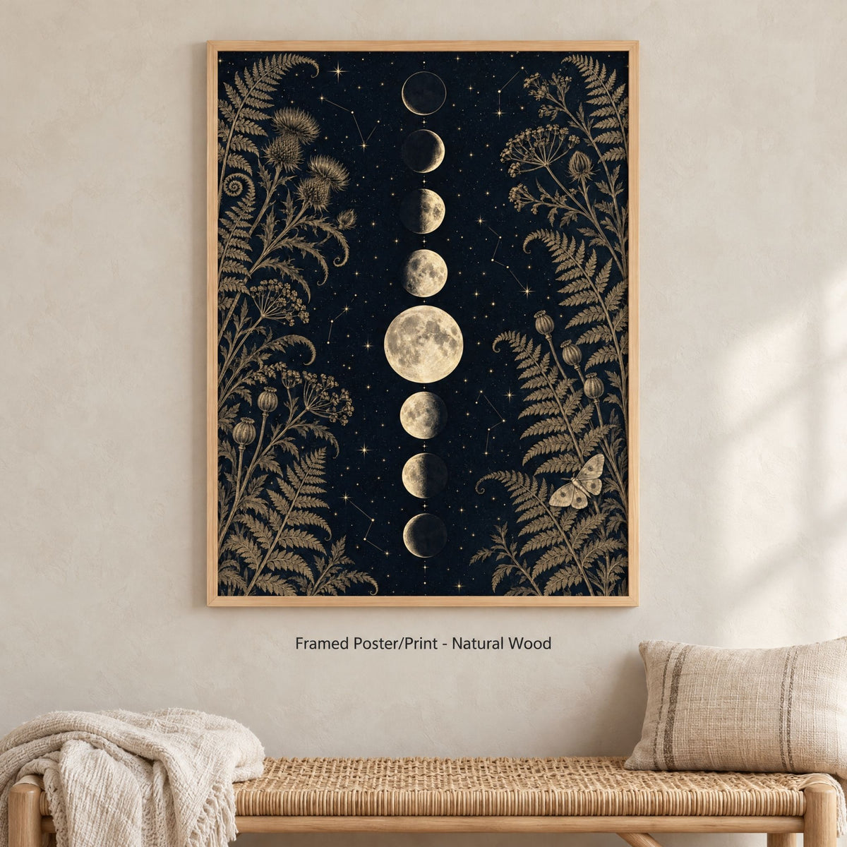 Gothic moon phase print in a natural wood frame above a woven rattan bench on a limewash wall