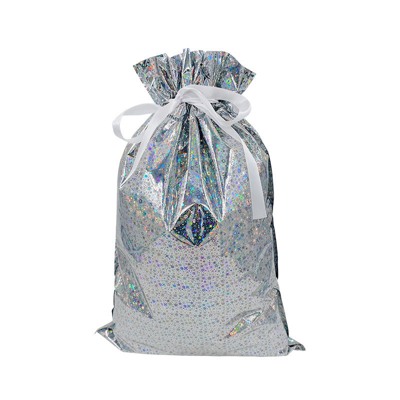 Silver glittery drawstring bag with a white ribbon on a white background