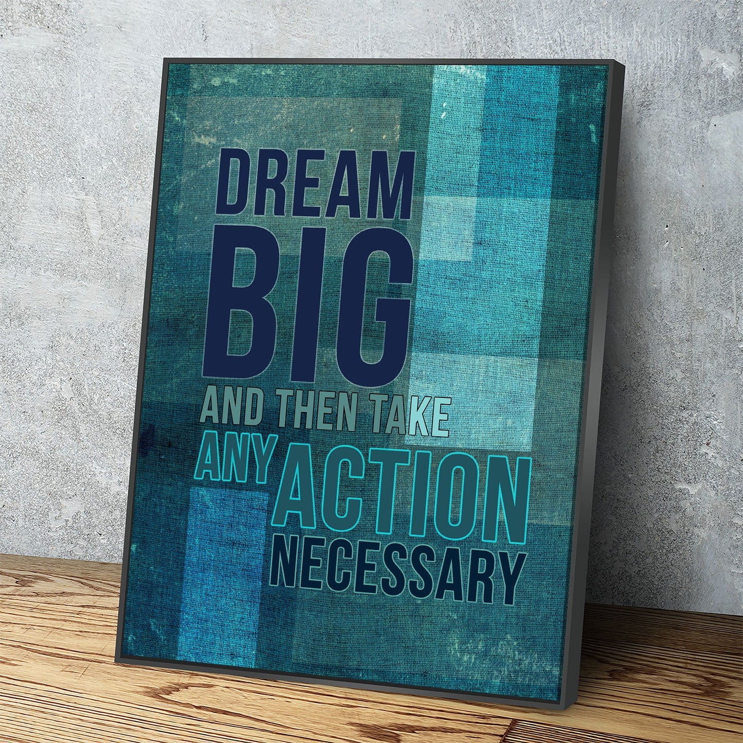 Dream Big motivational canvas wall art hanging in a home office
