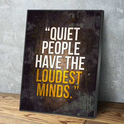 Quiet People Have The Loudest Minds motivational canvas in a reading nook