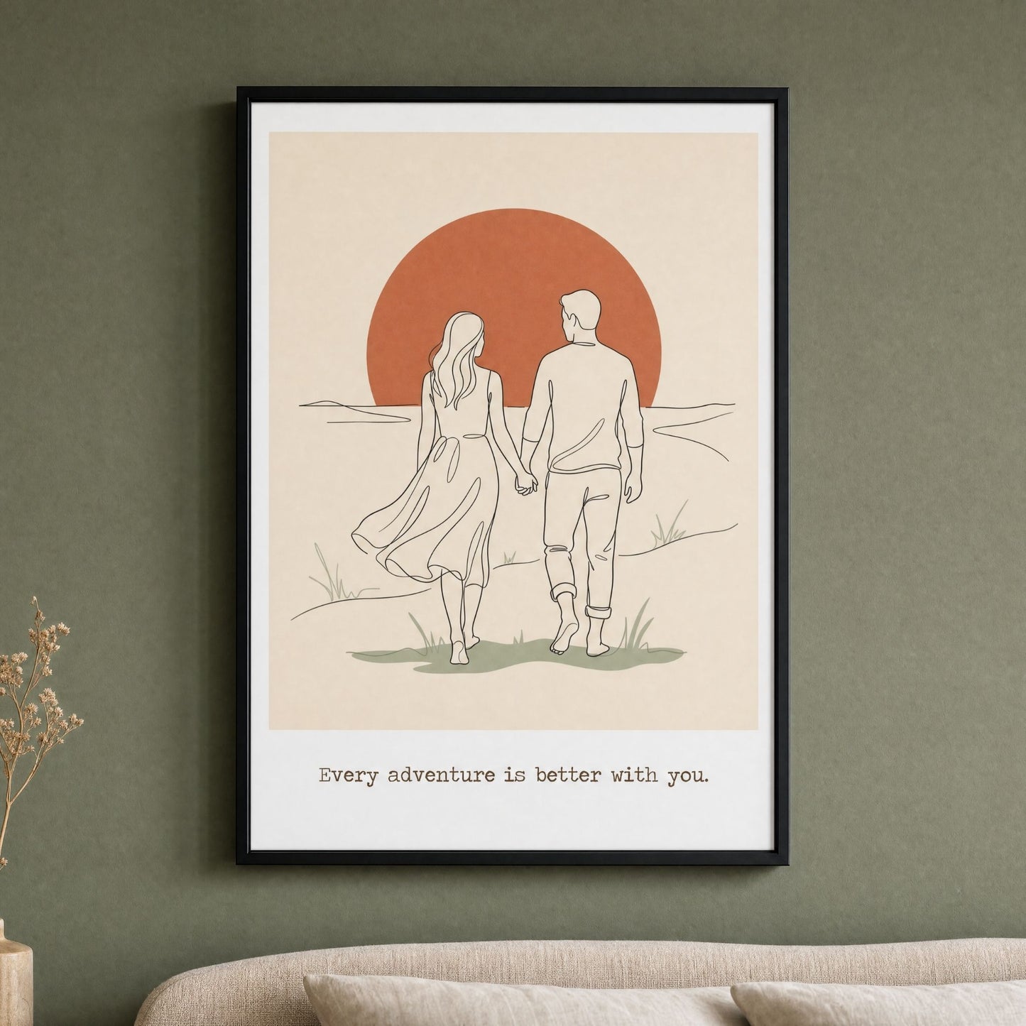 Mid century modern couples print in a black frame, hung above a bed on a deep sage green wall.