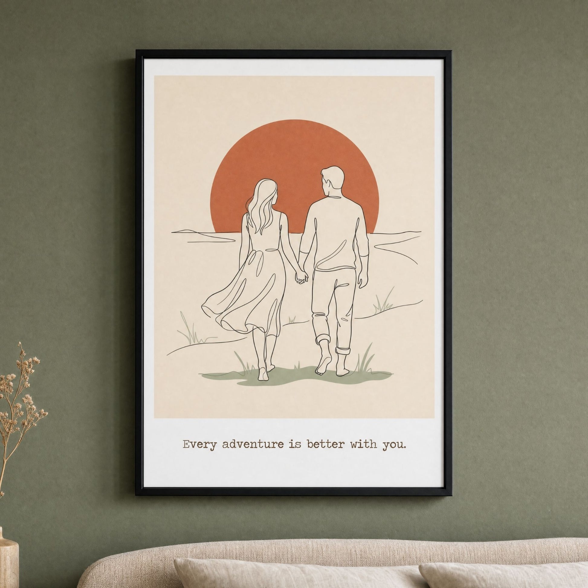 Mid century modern couples print in a black frame, hung above a bed on a deep sage green wall.