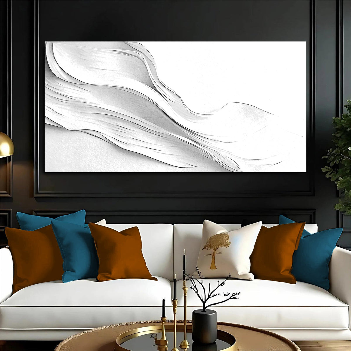 White swirl on a white canvas hung on a black wall above a white sofa