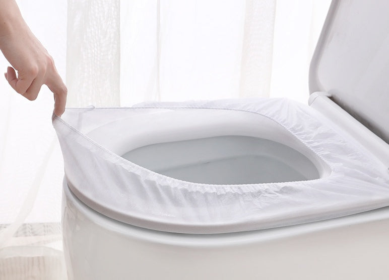 Elastic universal-fit disposable toilet seat cover on elongated seat