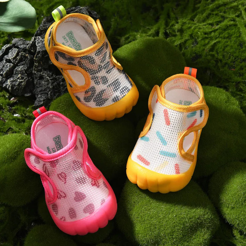 children's water shoes on a green leafy background