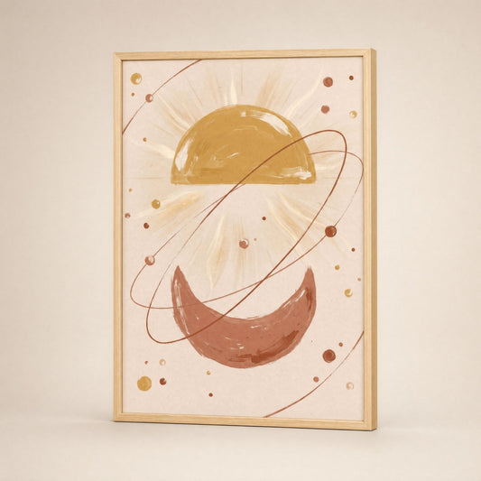 Sun and moon wall art in a natural wood frame, leaning against a pale wall in soft daylight.