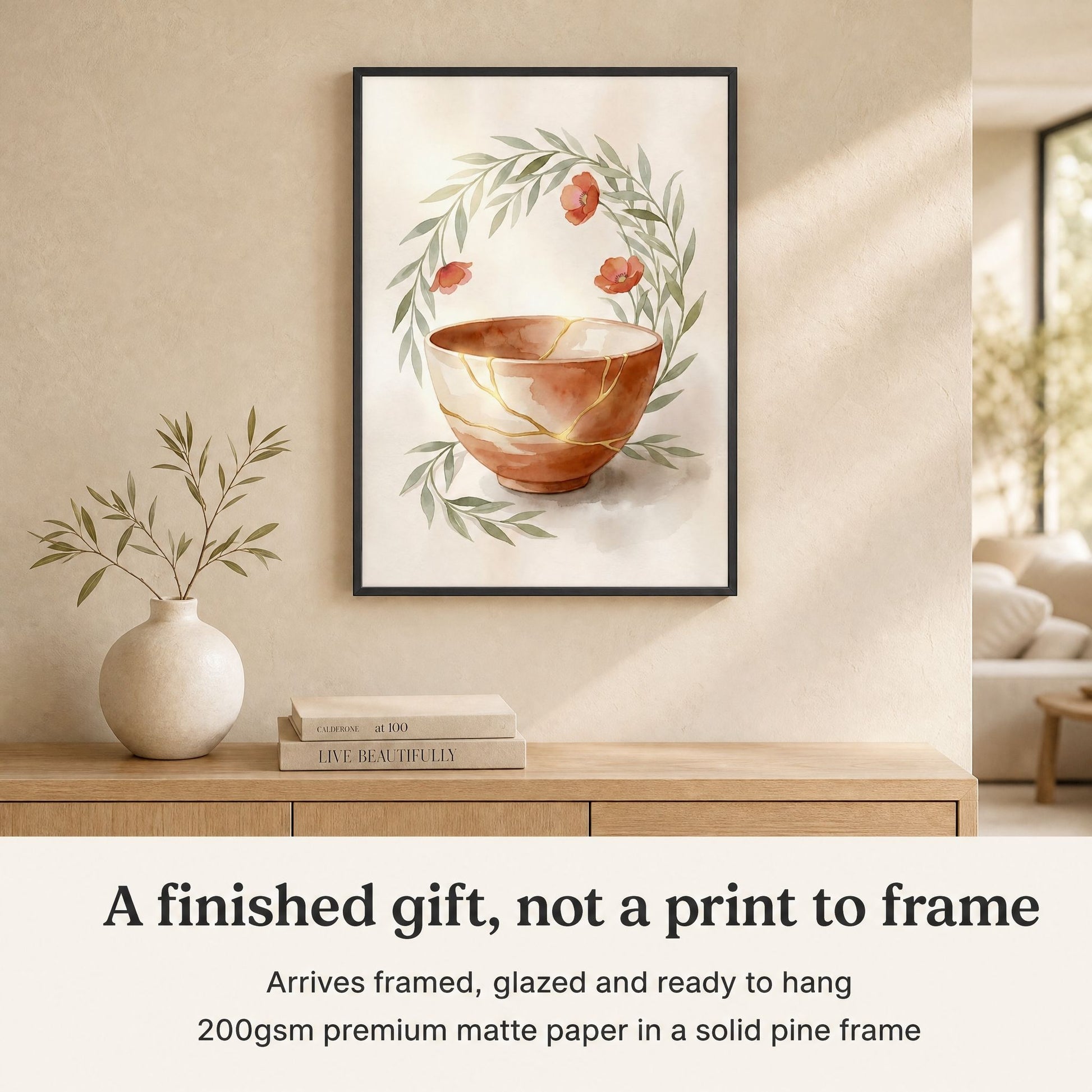 Framed kintsugi print above an oak console, with a note that it arrives framed, glazed and ready to hang