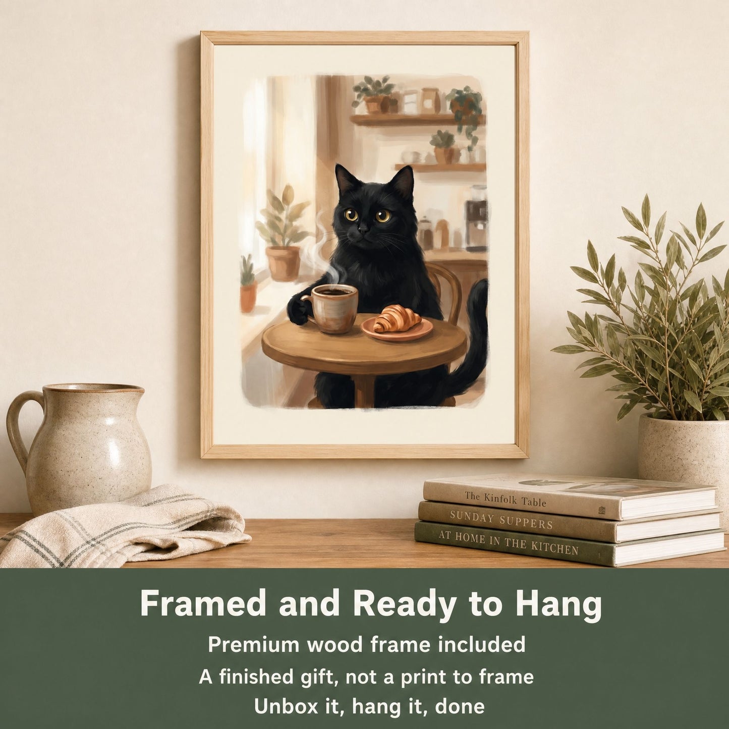 Framed cat coffee poster leaning on a shelf beside a stoneware jug and books, hanging hardware already fitted