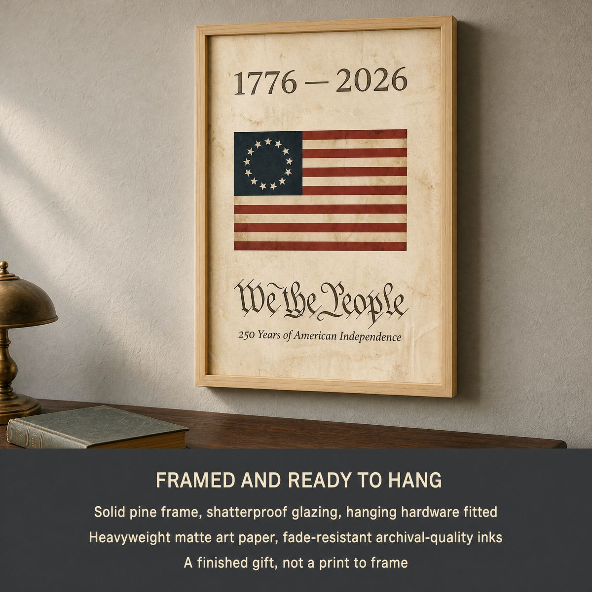 Framed 1776 We the People wall art hung above a walnut desk and brass lamp, with a panel listing the solid pine frame, shatterproof glazing and matte art paper included