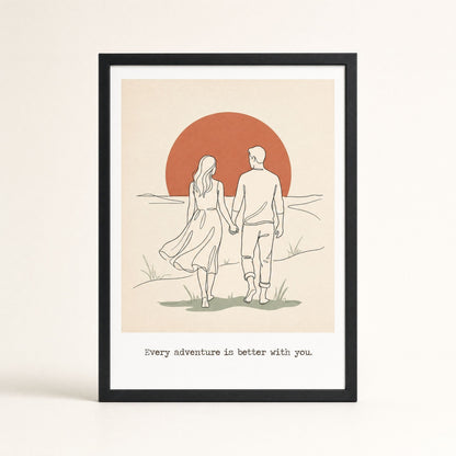 Framed bedroom wall art of a couple walking into a terracotta sunset, in a black wood frame, ready to hang.