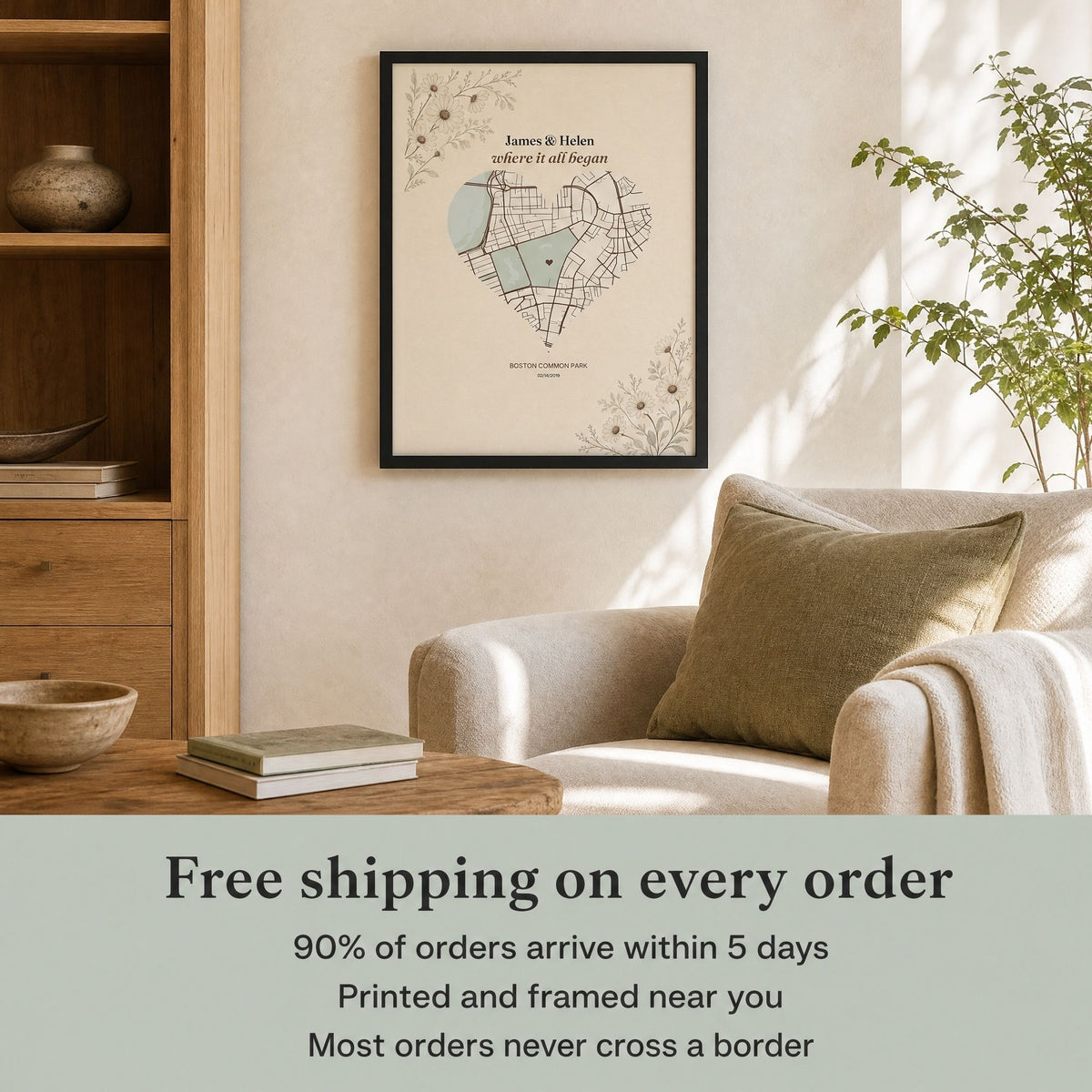 Black-framed heart map print on a wall above a cream armchair and oak shelving, with text: Free shipping on every order, 90% of orders arrive within 5 days, printed and framed near you, most orders never cross a border