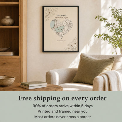 Black-framed heart map print on a wall above a cream armchair and oak shelving, with text: Free shipping on every order, 90% of orders arrive within 5 days, printed and framed near you, most orders never cross a border