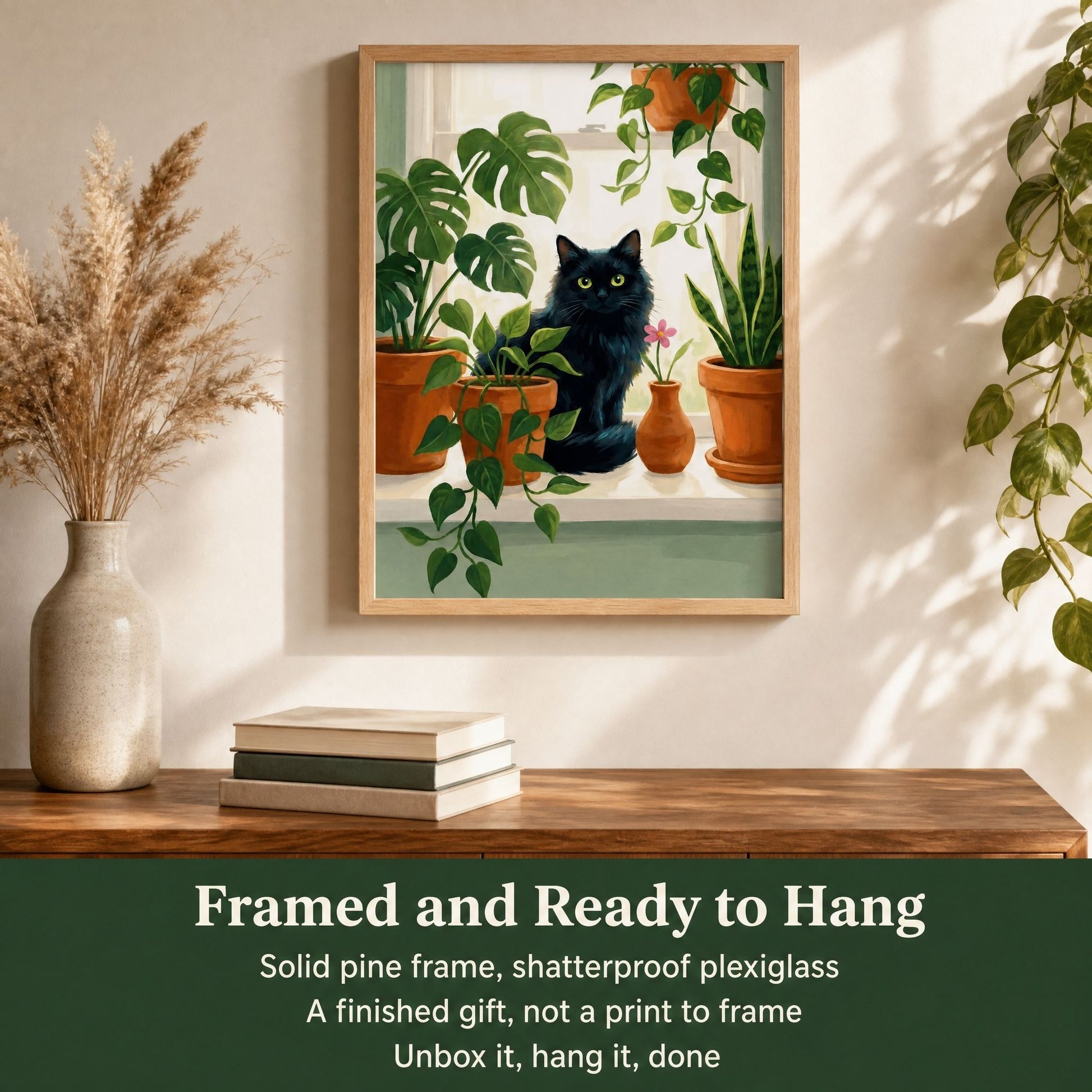 Framed black cat and monstera print above a console, ready to hang with a solid pine frame