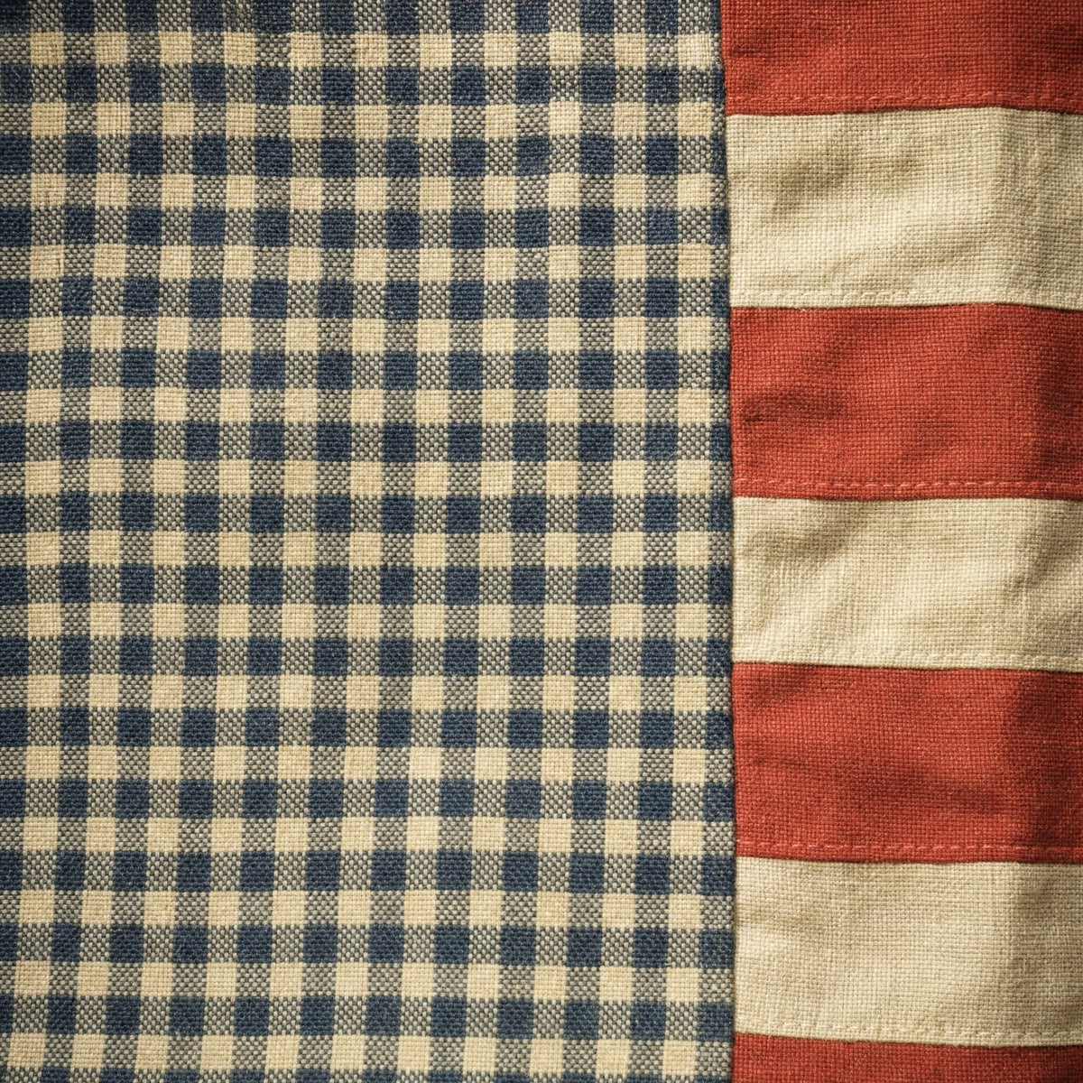 Close-up of the woven navy and oatmeal gingham canton and the aged red and cream stripes on the vintage American flag print