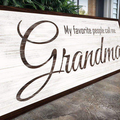 Angled close-up of the My Favorite People Call Me Grandma canvas sign showing the brown script on white