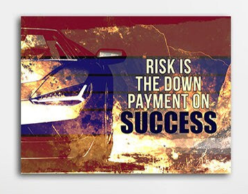 Risk Is The Down Payment For Success quote canvas wall art in an office