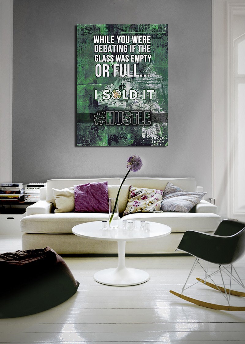 Motivational sales quote canvas wall art in a home office