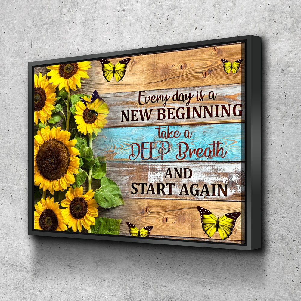 Every Day Is A New Beginning canvas wall art above a headboard