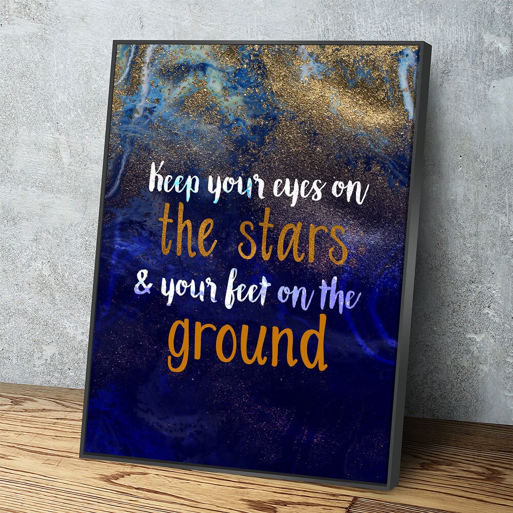 Eyes on the stars feet on the ground quote canvas in a bedroom