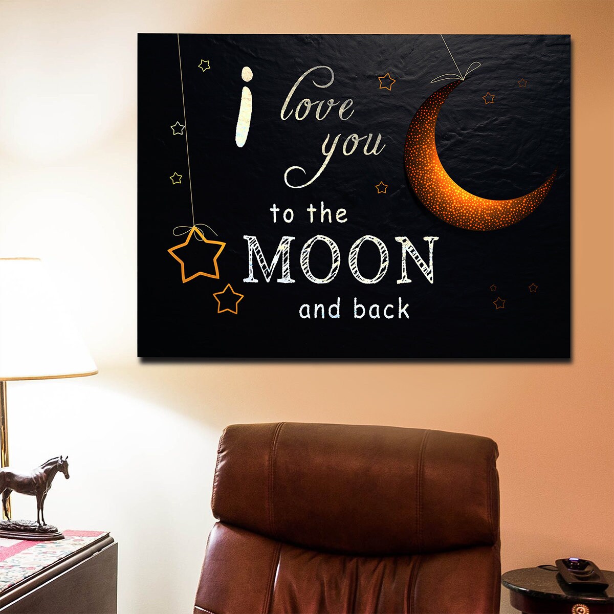I Love You To The Moon And Back canvas wall art above a bed
