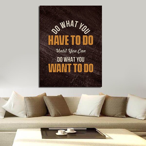 Do what you have to do hustle quote canvas in a home office