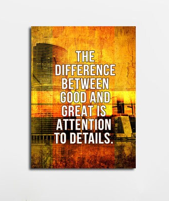 Attention to detail motivational quote canvas in an office setting