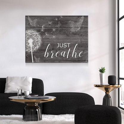 Just Breathe canvas wall art above a bed in a romantic bedroom