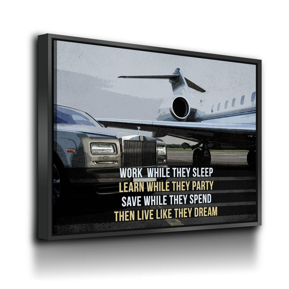 Work While They Sleep motivational quote canvas in a home office