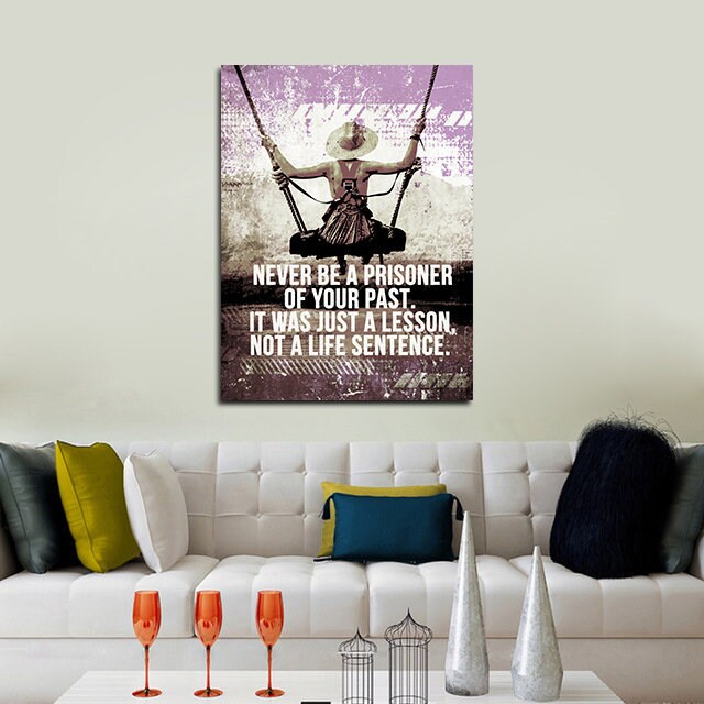 Never Be A Prisoner Of Your Past motivational canvas wall art in a home office